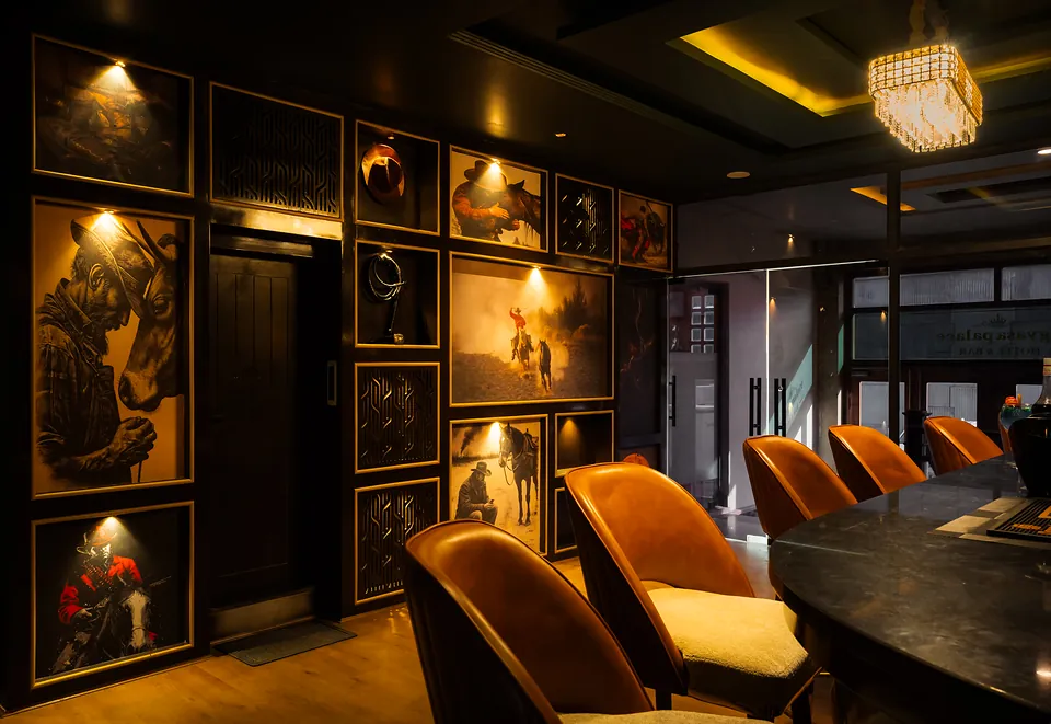 Rajasthani art wall and armchairs in the hotel bar