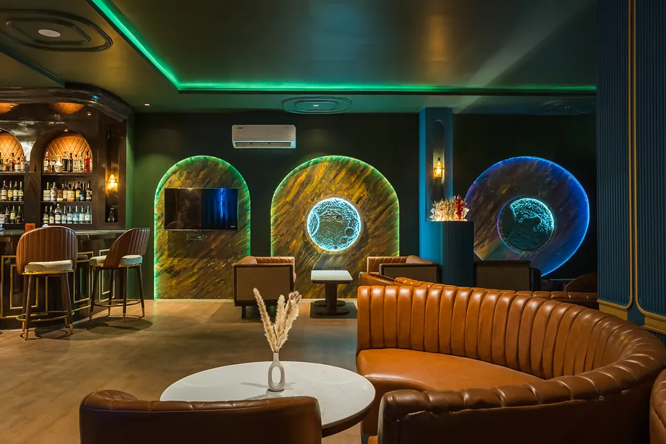 Bar counter and neon-lit arches at Jigyasa Palace