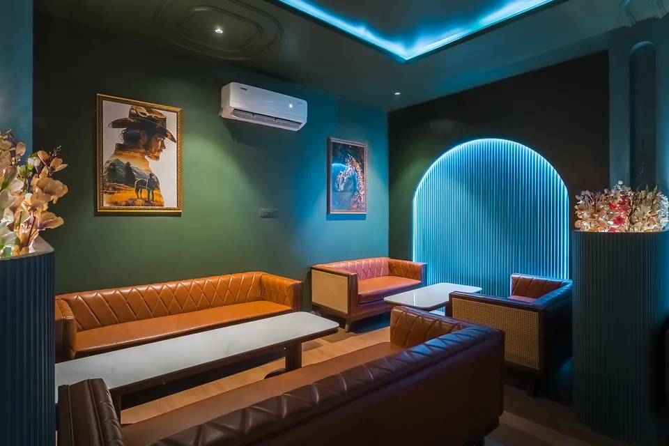 Lounge sofas and illuminated arch in the hotel bar