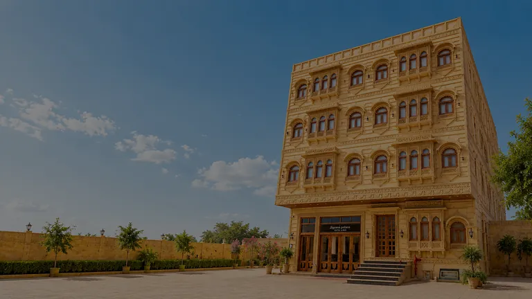 Five-floor yellow sandstone facade of Hotel Jigyasa Palace in Jaisalmer