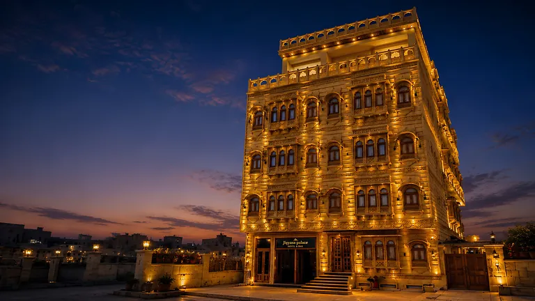 Hotel Jigyasa Palace golden sandstone facade lit up at night, Jaisalmer