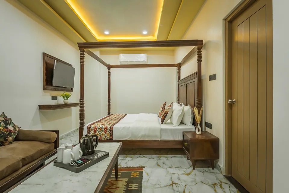 Spacious King Suite with lounge sofa and smart TV